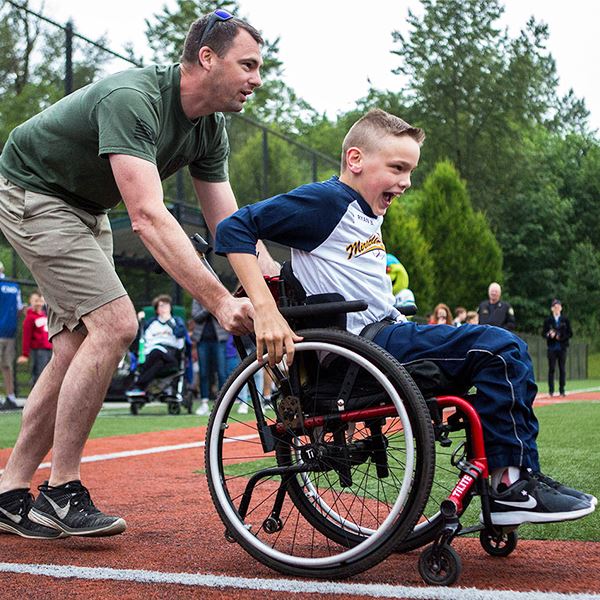 A kid playing during Miracle League A kid playing during Miracle League
